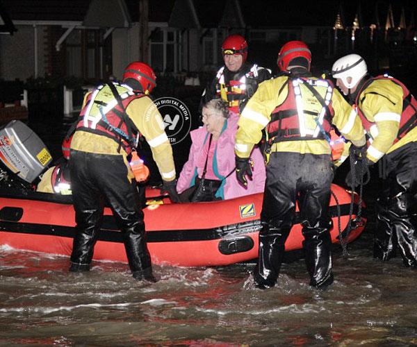 Sea walls breached in Britain