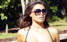 Jessica Wright squeezes into an unusual tie-up swimsuit