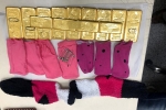 woman held with gold, shamshabad airport checking, woman held with 11 kg gold hidden in her specially made cloth pockets and socks at hyderabad airport, Dirham