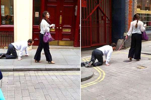 Lady walking a man like a dog},{Lady walking a man like a dog